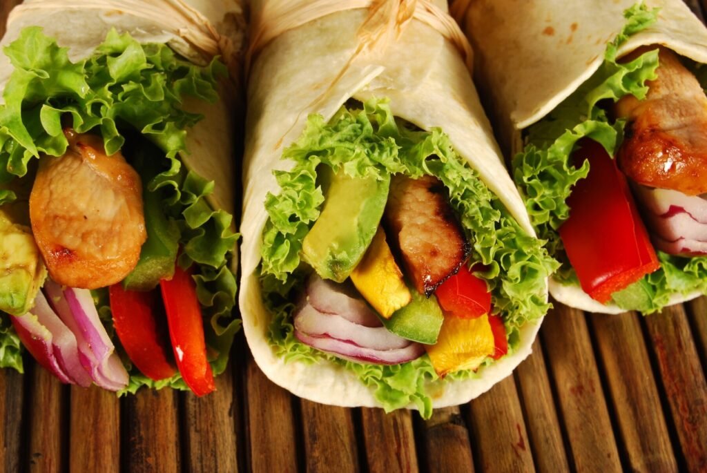 a group of tortillas with meat and vegetables