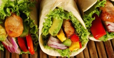 a group of tortillas with meat and vegetables