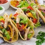 a group of tacos on a table