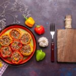 a plate of stuffed peppers and vegetables