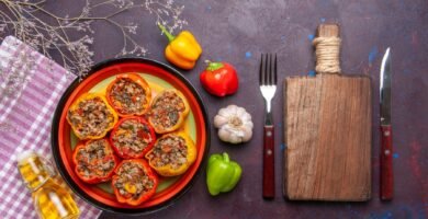 a plate of stuffed peppers and vegetables